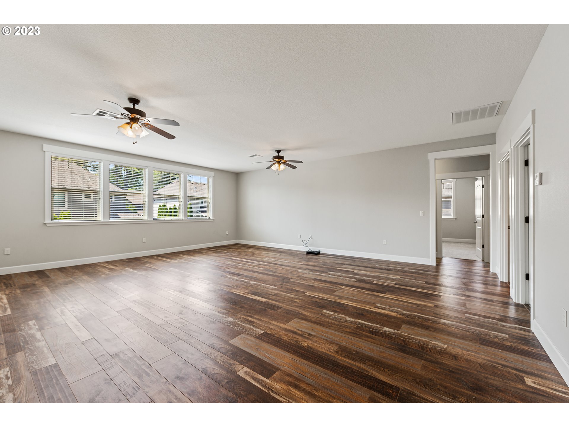 5316 Southwest Childs Road Lake Oswego, OR 97035 - Photo 28 of 42 a view of an empty room with a window and wooden floor