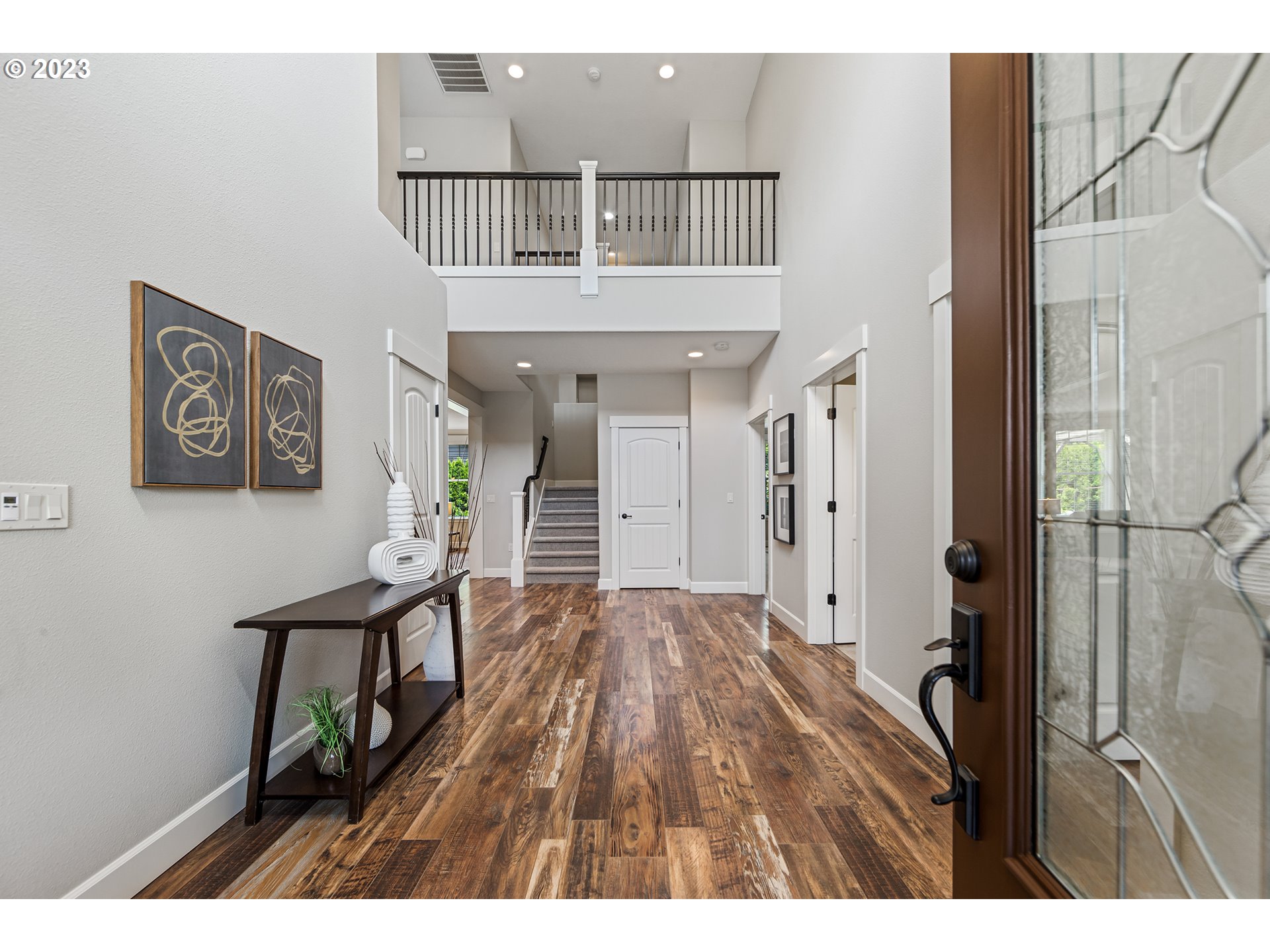 5316 Southwest Childs Road Lake Oswego, OR 97035 - Photo 5 of 42 a view of a hallway with wooden floor and entryway
