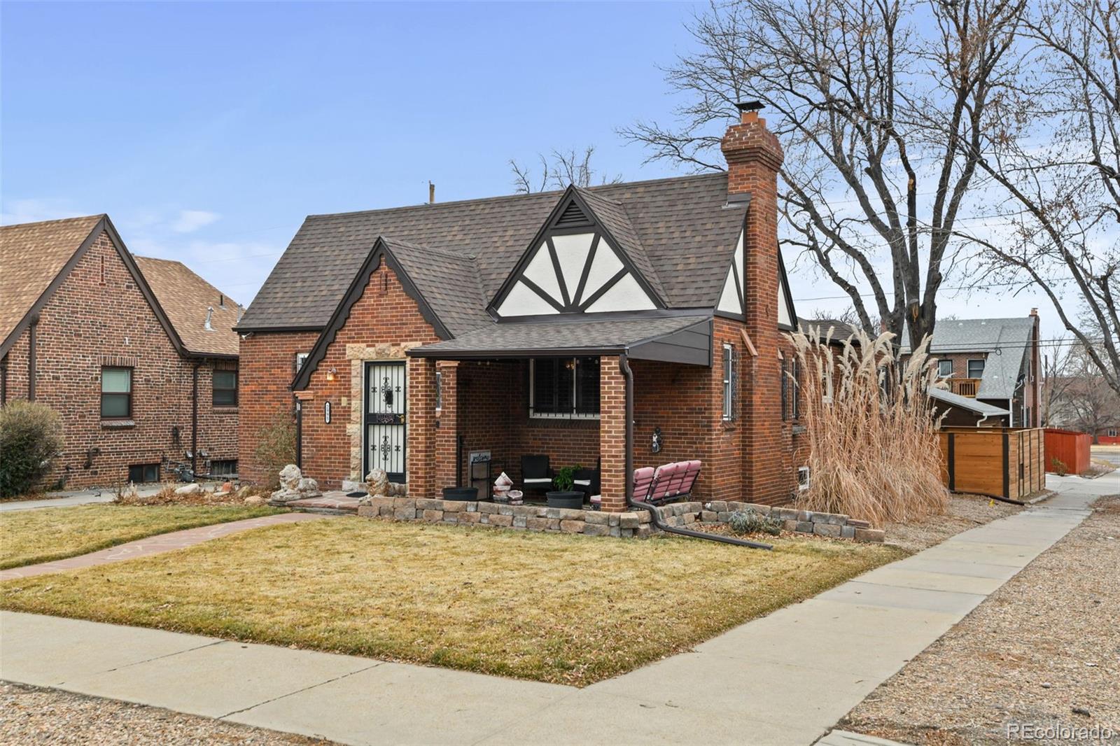 2995 Albion Street Denver, CO 80207 - Photo 2 of 40 front view of a house with a yard
