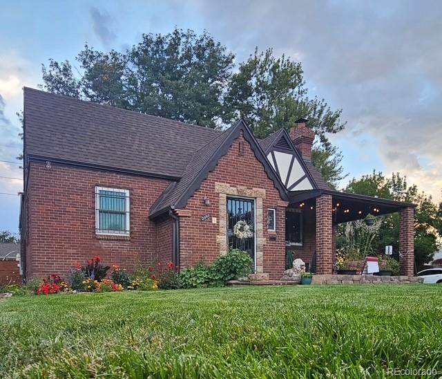 2995 Albion Street Denver, CO 80207 - Photo 38 of 40 a front view of a house with a garden