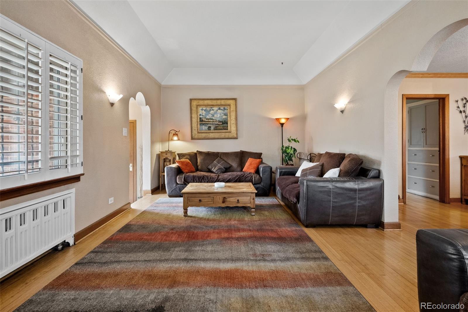 2995 Albion Street Denver, CO 80207 - Photo 6 of 40 a living room with furniture and a rug