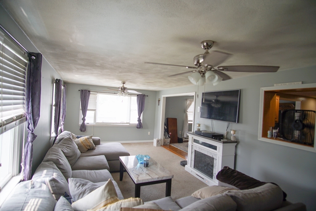 29 Garfield Avenue, Unit 2 Woburn, MA 01801 - Photo 2 of 10 a living room with furniture and a large window