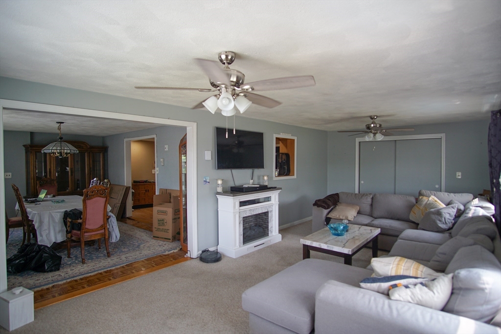 29 Garfield Avenue, Unit 2 Woburn, MA 01801 - Photo 3 of 10 a living room with furniture ceiling fan and a flat screen tv