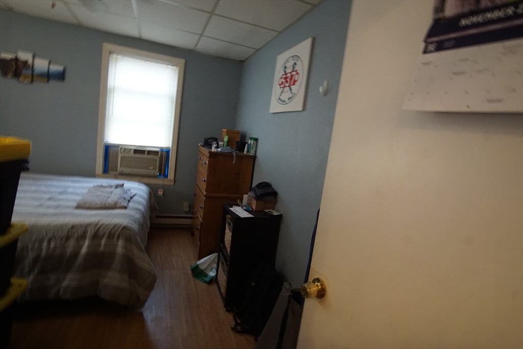 29 Garfield Avenue, Unit 2 Woburn, MA 01801 - Photo 9 of 10 a bedroom with a bed and a window