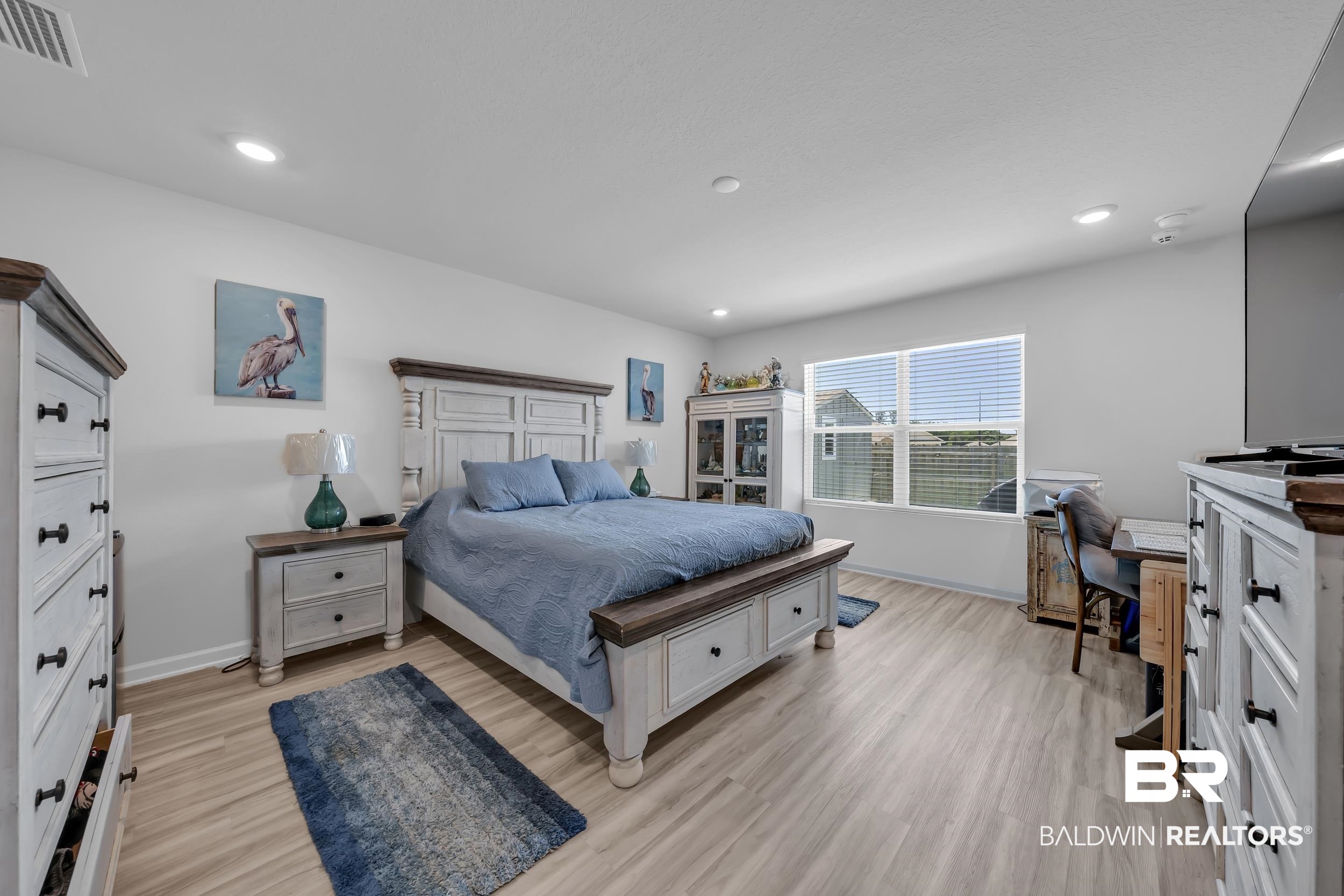 24271 Ringneck Loop Elberta, AL 36530 - Photo 21 of 44 Spacious room featuring light wood-finish flooring, recessed lighting, and a large window with horizontal blinds