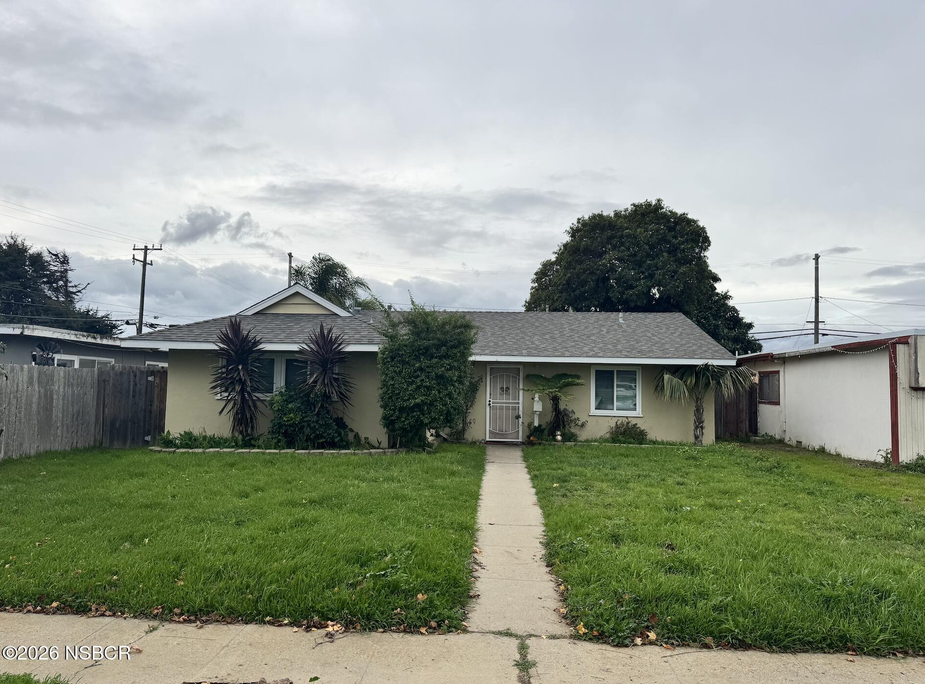 505 North 1st Street Lompoc, CA 93436 - Photo 1 of 6 a front view of a house with a yard
