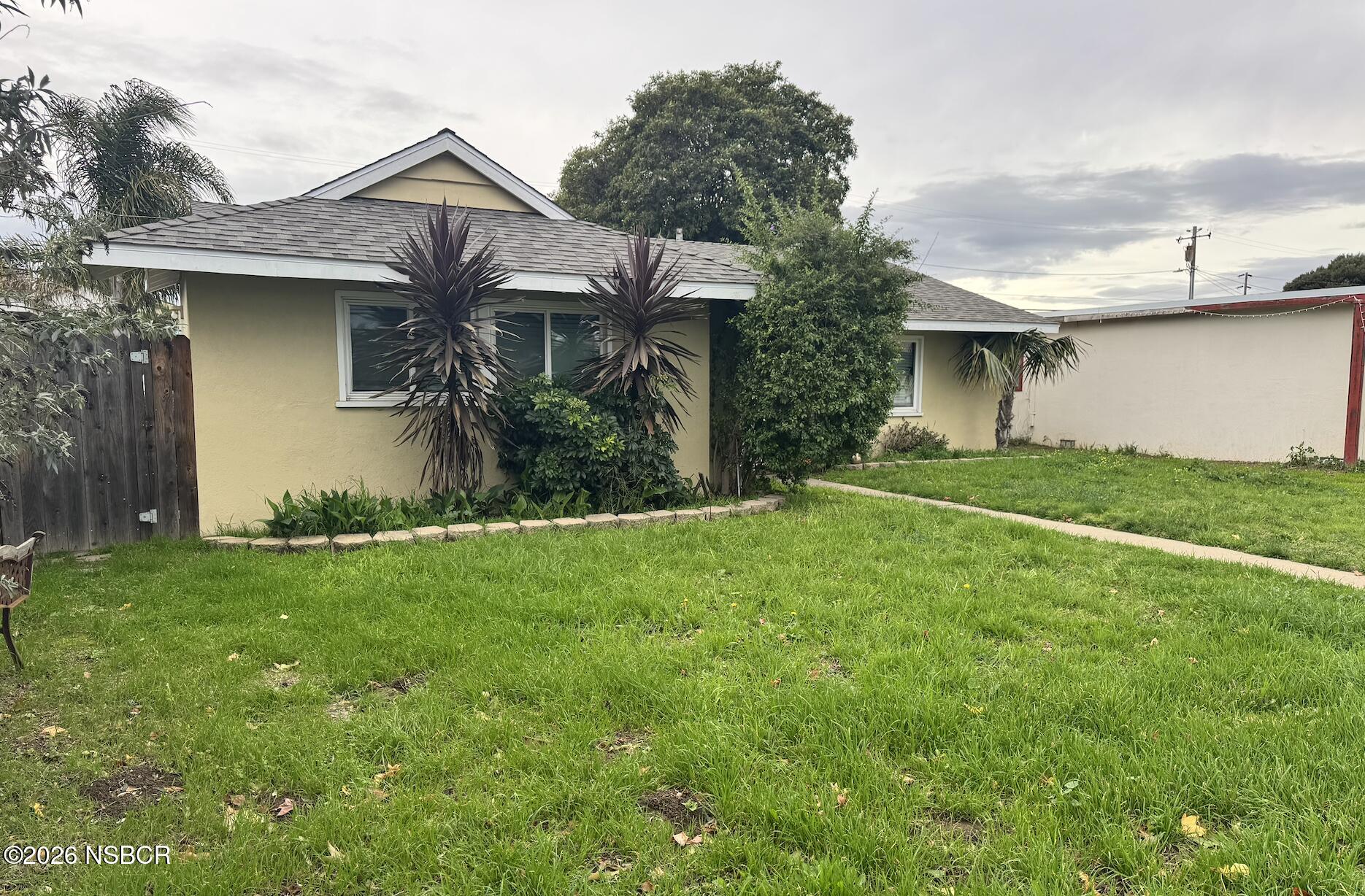505 North 1st Street Lompoc, CA 93436 - Photo 2 of 6 a view of a house with a yard and plants