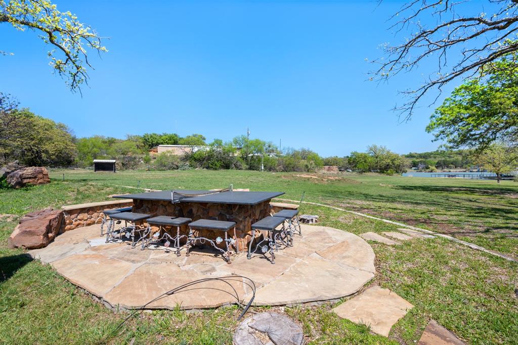 660 Deer Trail Gordon, TX 76453 - Photo 19 of 40 an outdoor view of a garden with patio