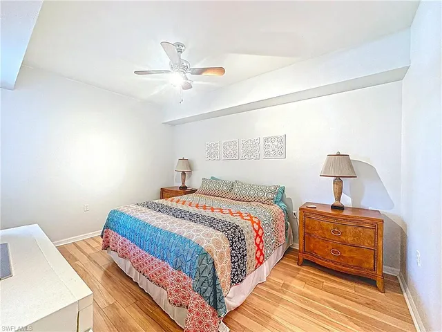 a bed room with a bed and a window