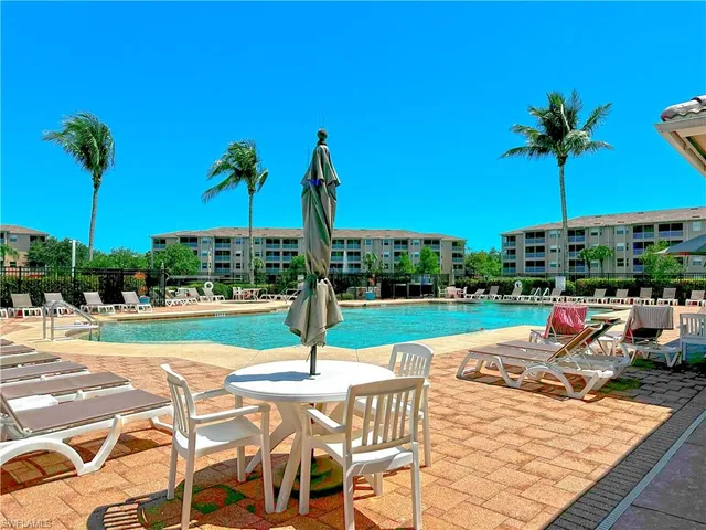 a view of a patio with a table chairs and a patio