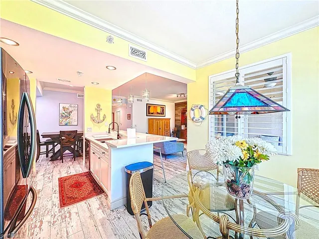 a dinning table and chairs in a room