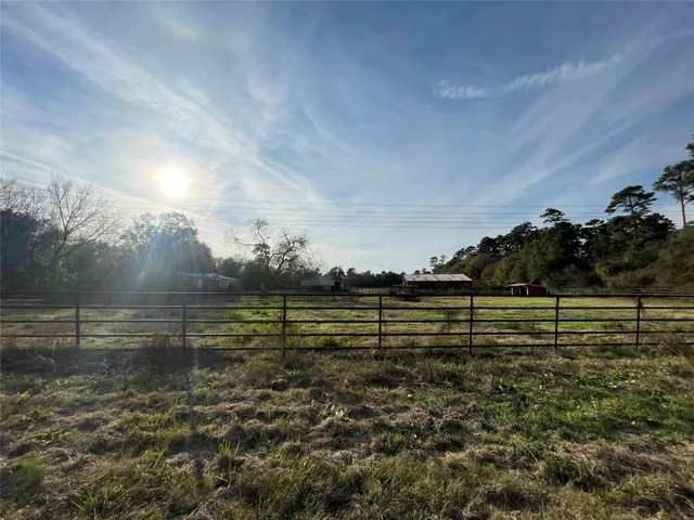 a view of a bench in front of a house
