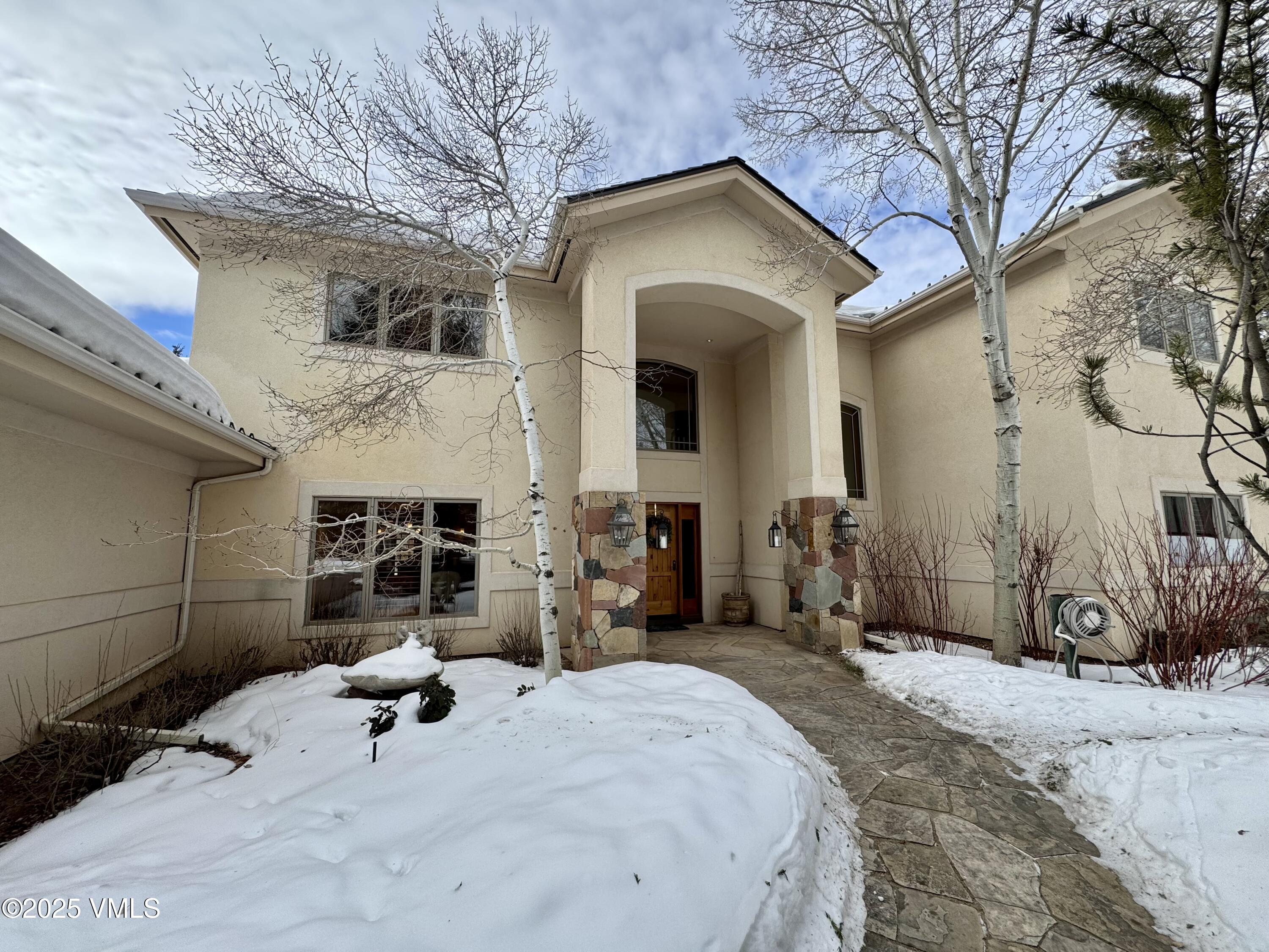 30 Shotgun Circle Edwards, CO 81632 - Photo 13 of 13 a front view of a house with a yard and garage
