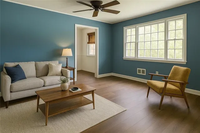 a living room with furniture and a window