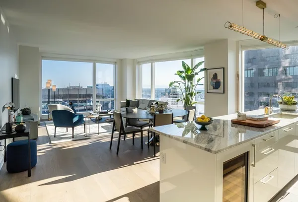a view of a dining room with furniture window and outside view