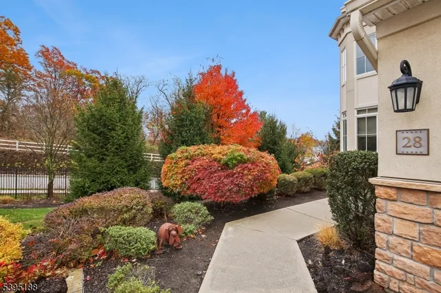 a pathway of a house with a yard