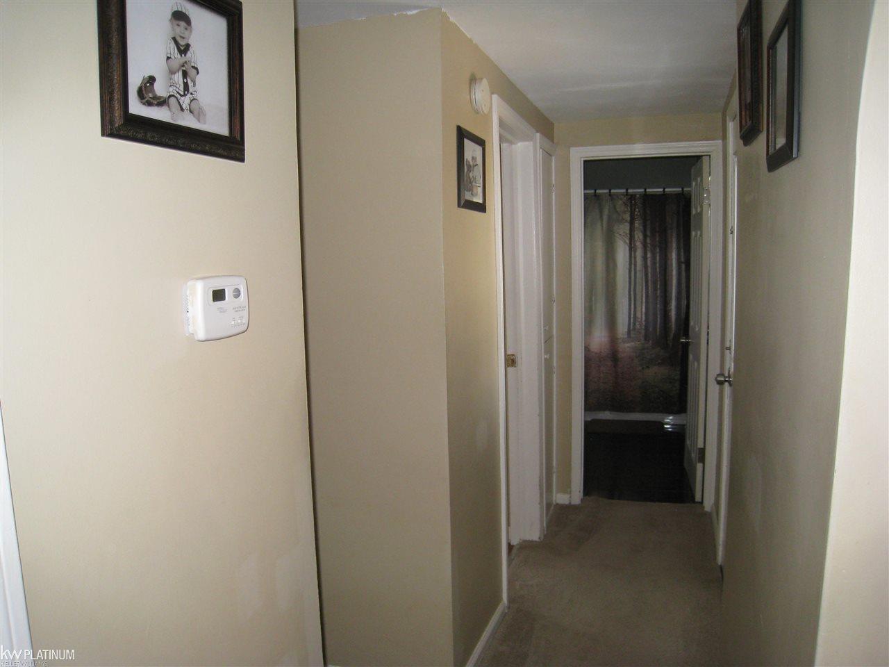 2165 Haines Road Lapeer, MI 48446 - Photo 19 of 37 Hall to large bedroom and bathroom