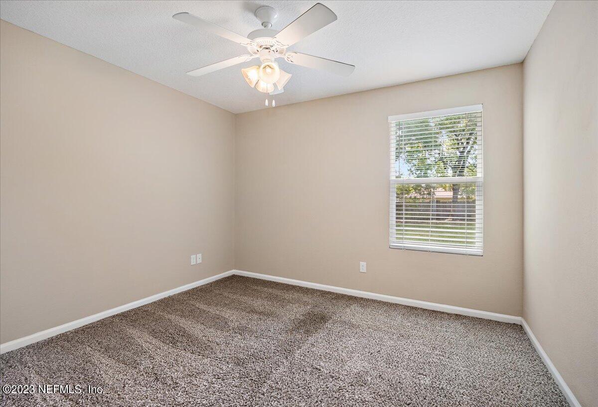 5418 Manfields Place Jacksonville, FL 32207 - Photo 18 of 21 an empty room with a window