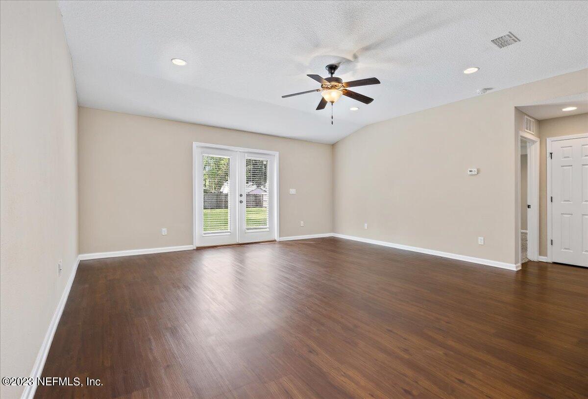 5418 Manfields Place Jacksonville, FL 32207 - Photo 10 of 21 a view of empty room with wooden floor and fan