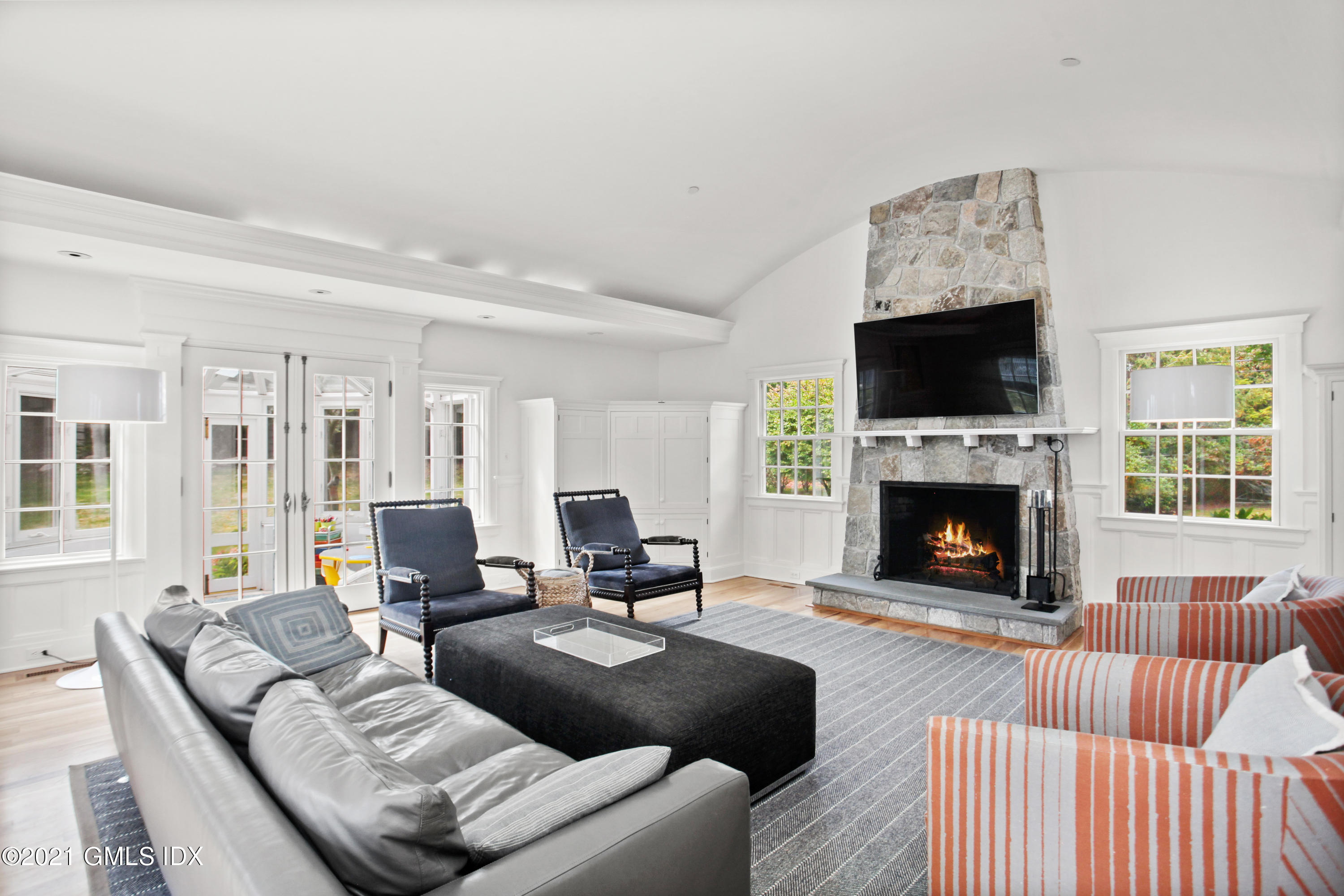 8 Cathlow Drive Riverside, CT 06878 - Photo 14 of 44 a living room with furniture fireplace and a flat screen tv