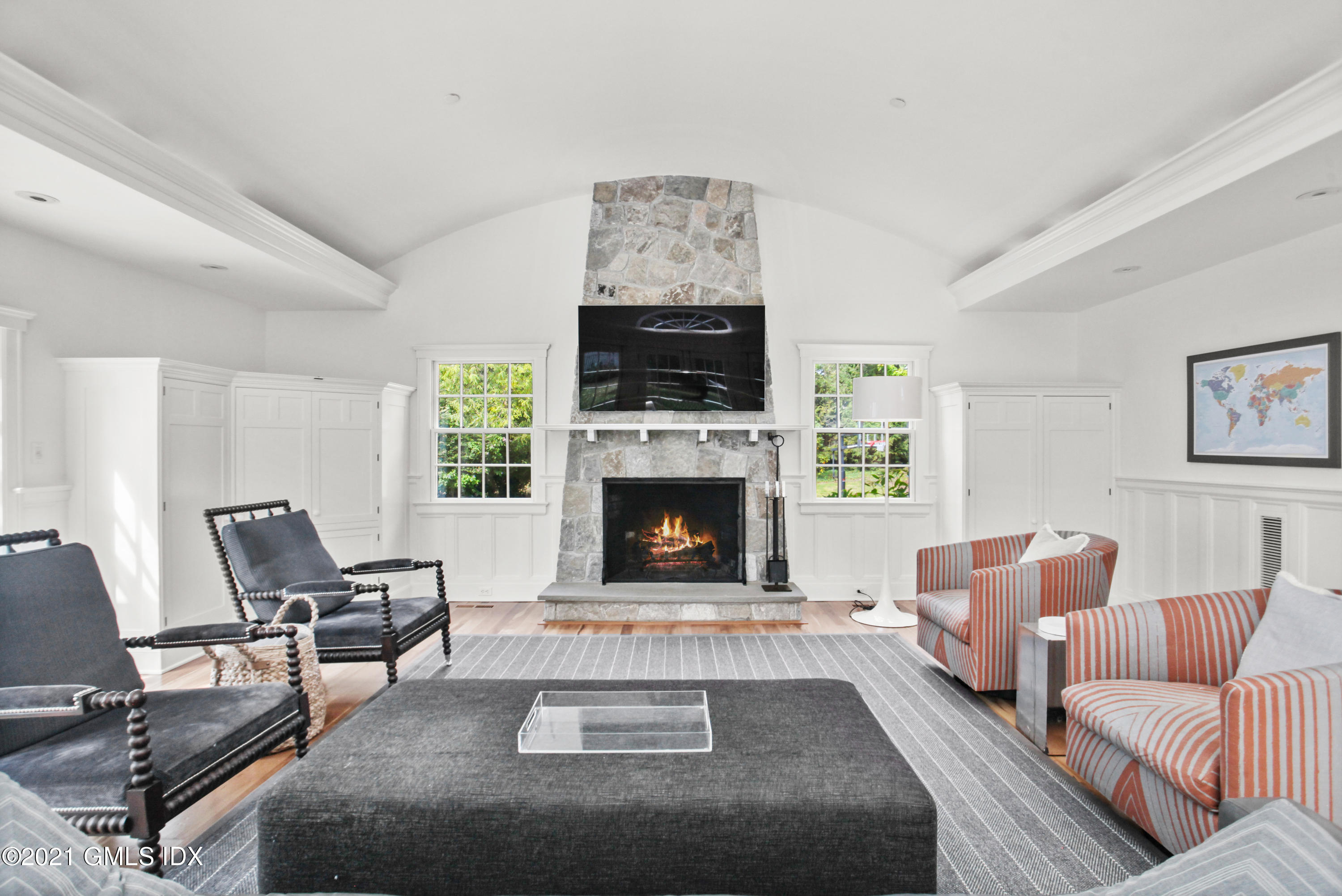 8 Cathlow Drive Riverside, CT 06878 - Photo 15 of 44 a living room with furniture a flat screen tv and a fireplace