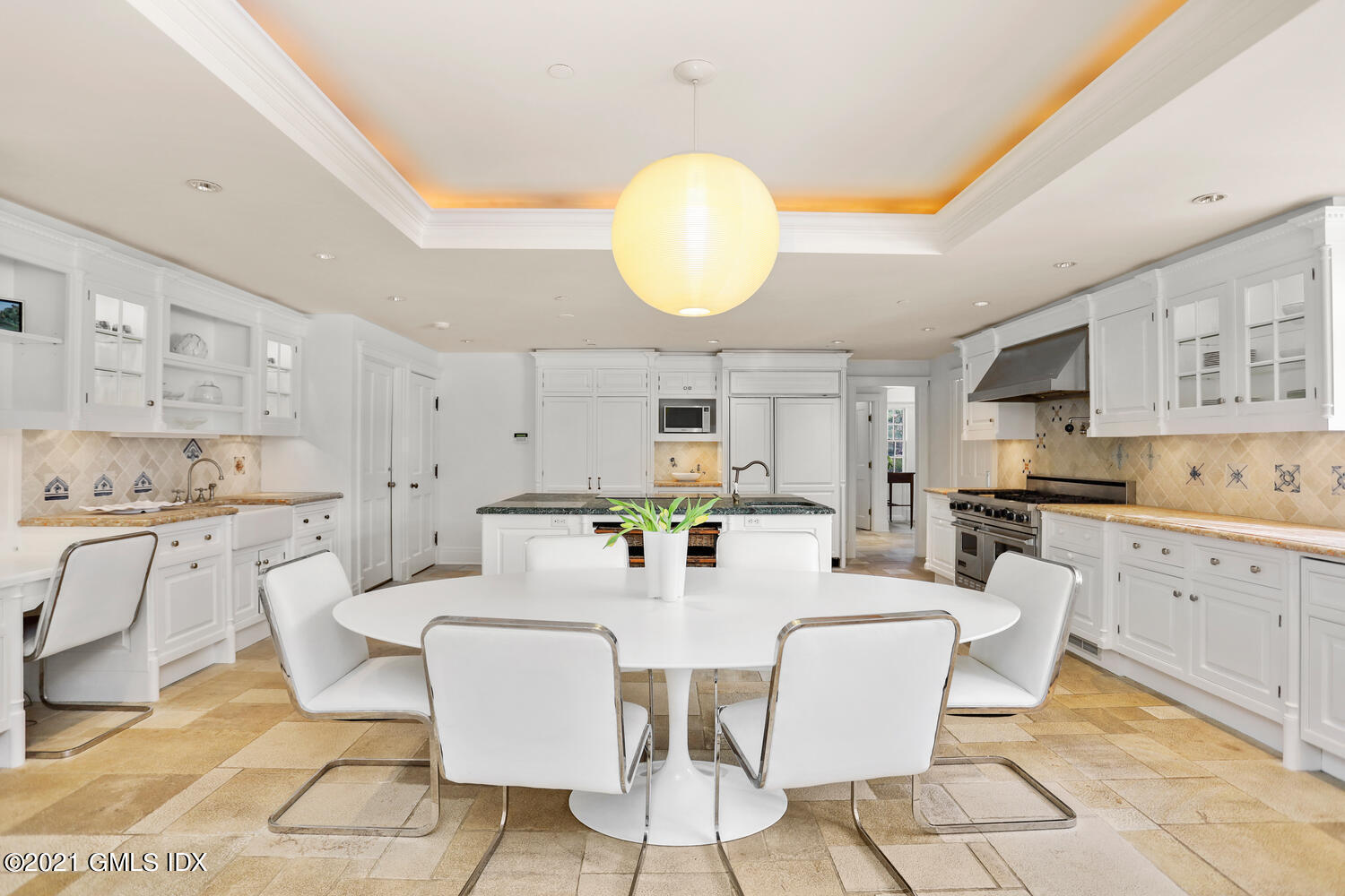 8 Cathlow Drive Riverside, CT 06878 - Photo 20 of 44 a large kitchen with white cabinets and stainless steel appliances