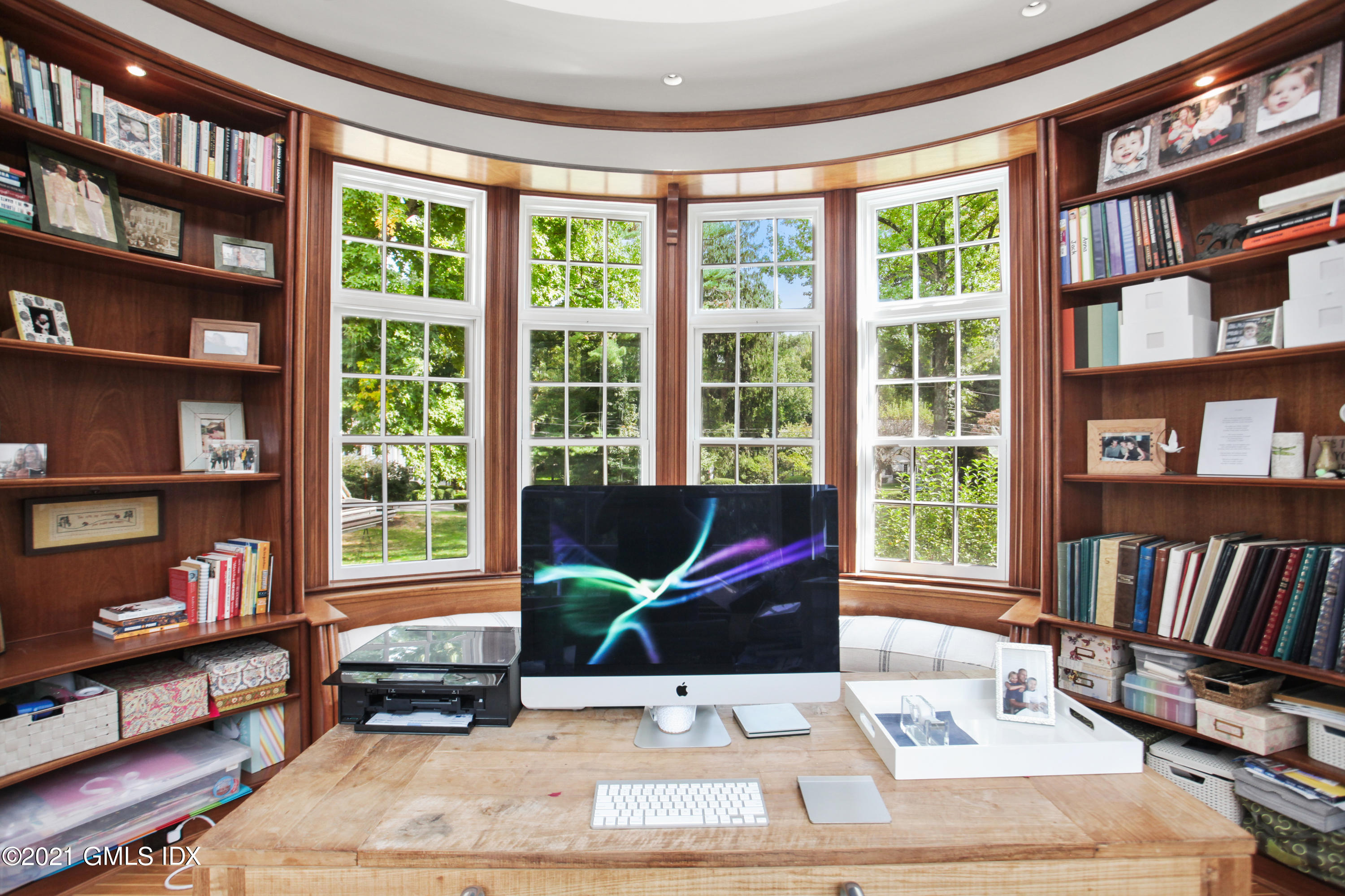 8 Cathlow Drive Riverside, CT 06878 - Photo 25 of 44 a living room with large window and a book shelf
