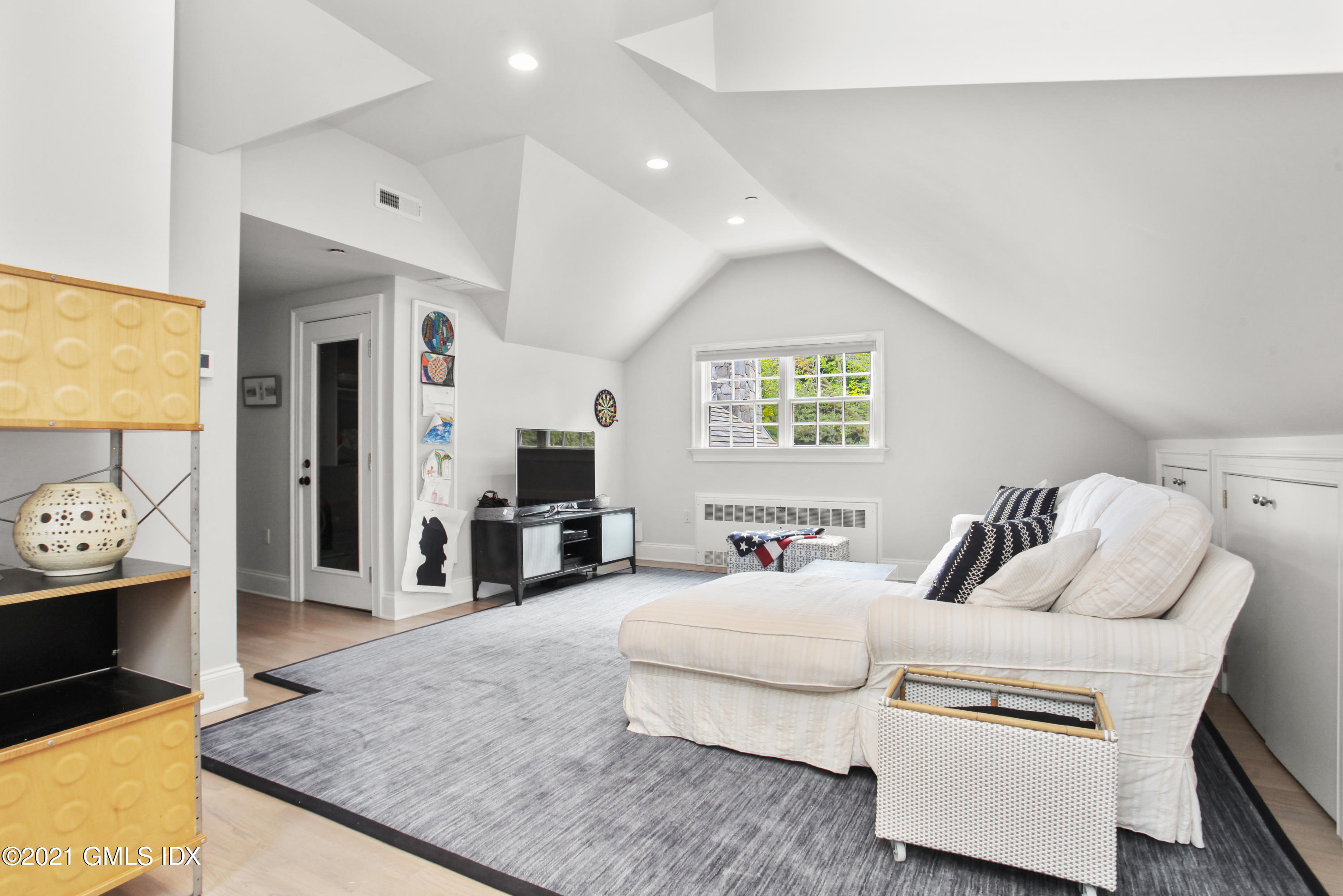 8 Cathlow Drive Riverside, CT 06878 - Photo 26 of 44 a living room with furniture and a flat screen tv
