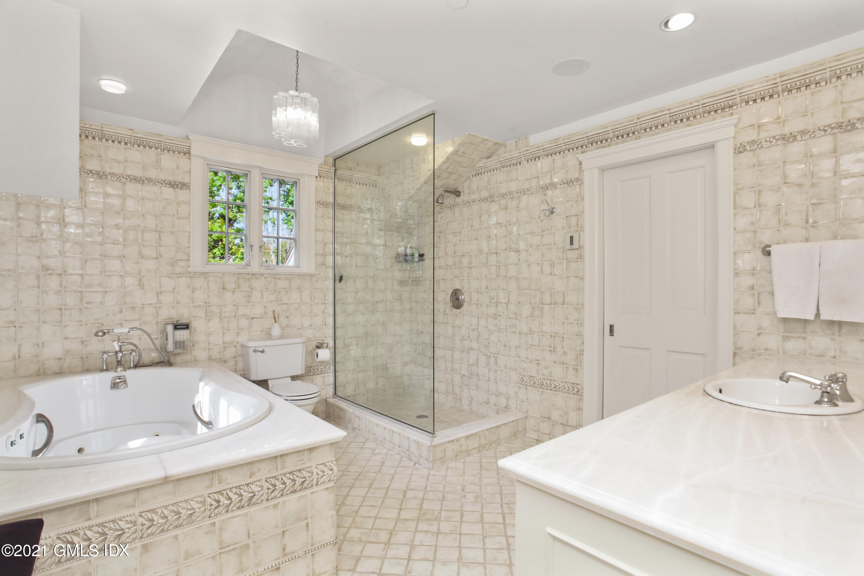 8 Cathlow Drive Riverside, CT 06878 - Photo 30 of 44 a bathroom with a tub sink and shower