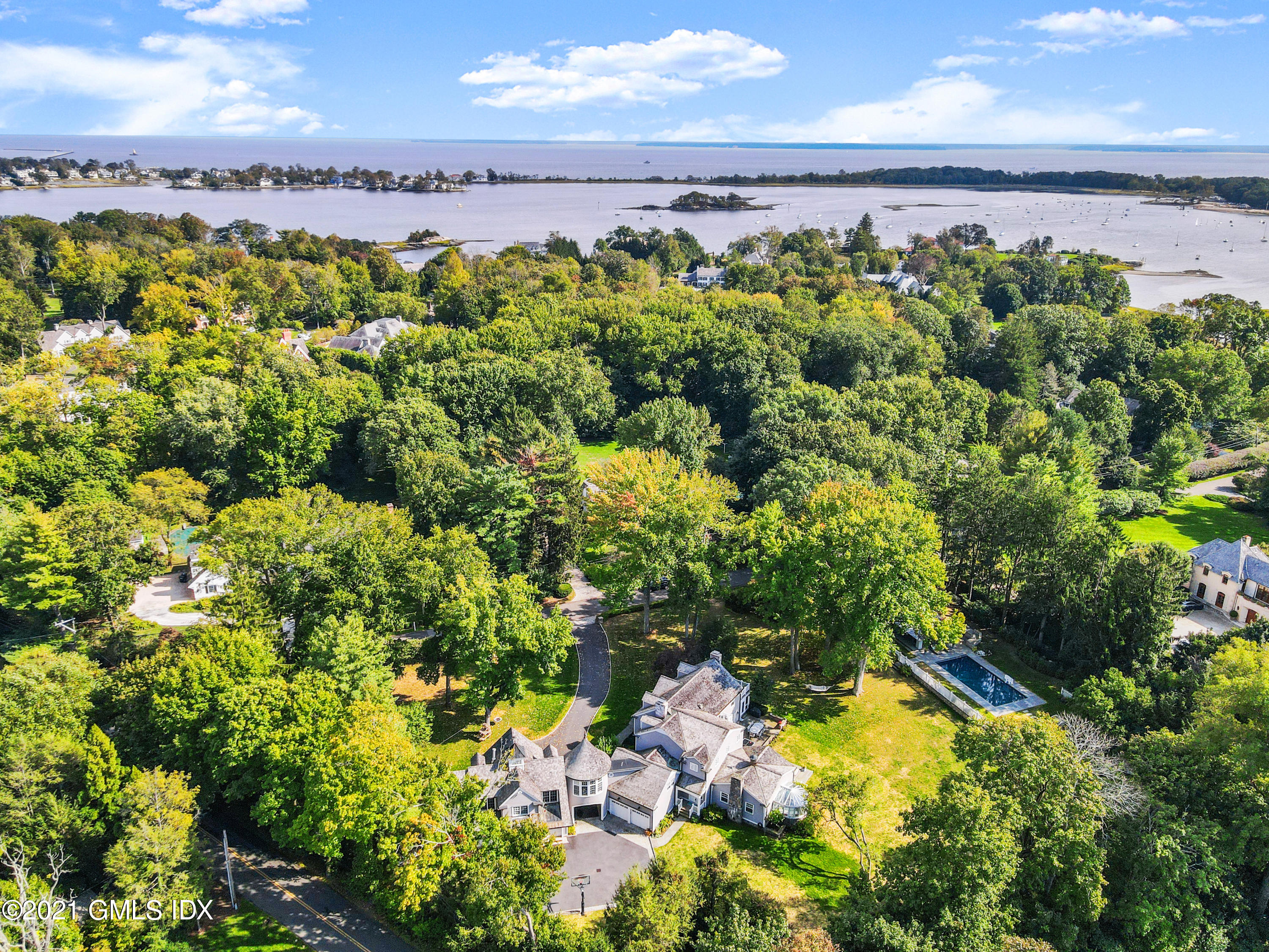 8 Cathlow Drive Riverside, CT 06878 - Photo 4 of 44 a view of a lake with a building in the background