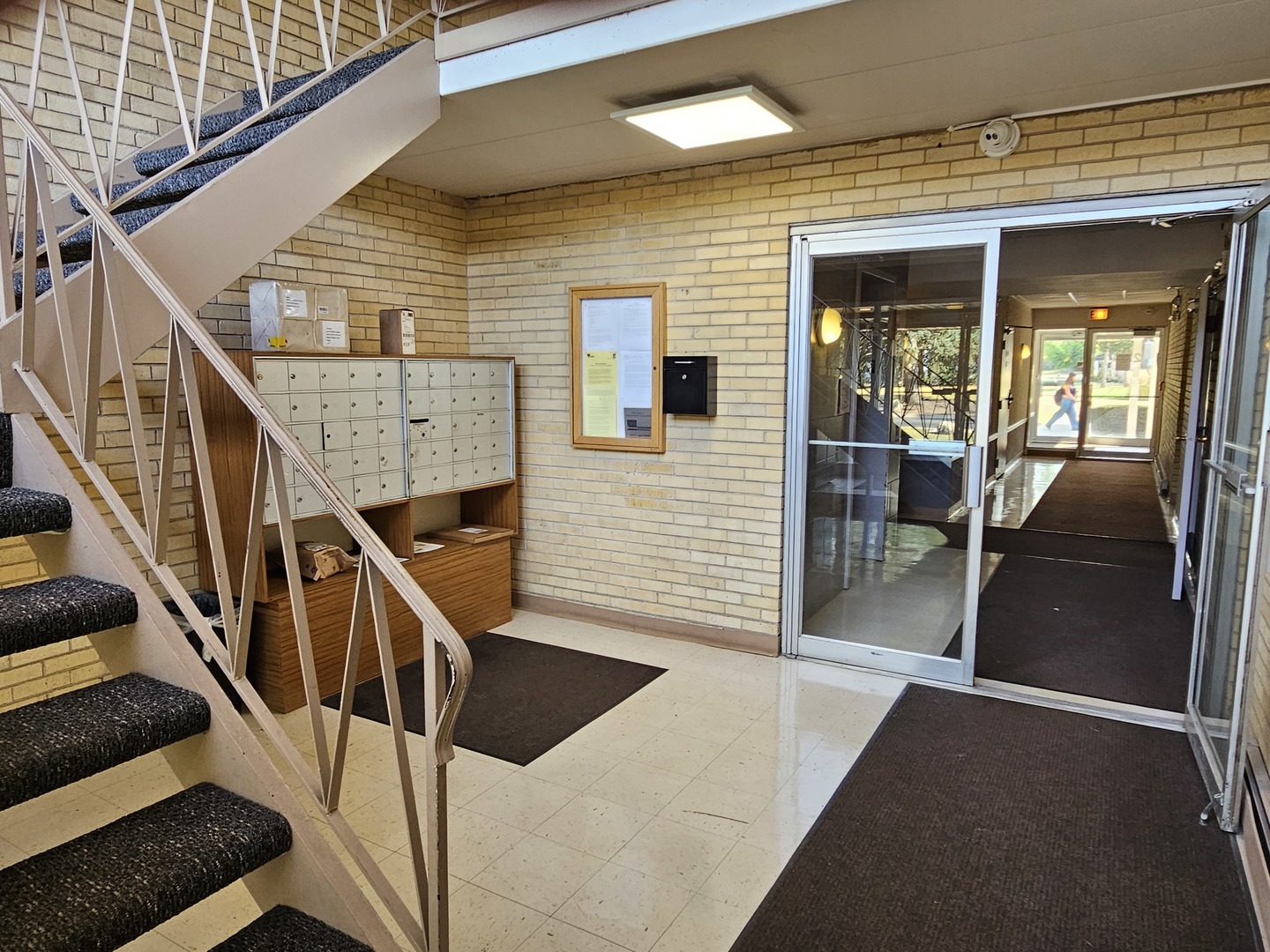 2214 South Goebbert Road, Unit 276 Arlington Heights, IL 60005 - Photo 12 of 17 a view of entryway and hall with wooden floor