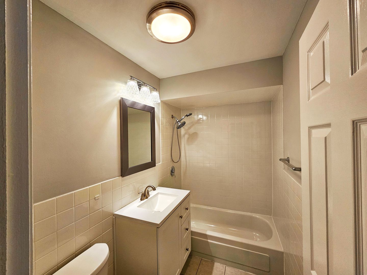 2214 South Goebbert Road, Unit 276 Arlington Heights, IL 60005 - Photo 6 of 17 a bathroom with a sink a toilet and shower