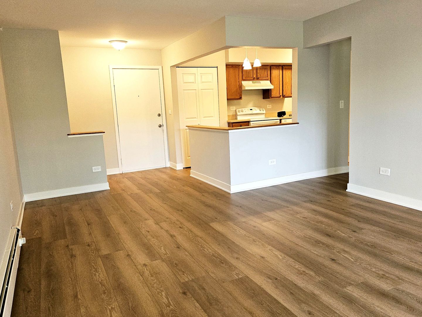 2214 South Goebbert Road, Unit 276 Arlington Heights, IL 60005 - Photo 10 of 17 a view of a kitchen from the hallway