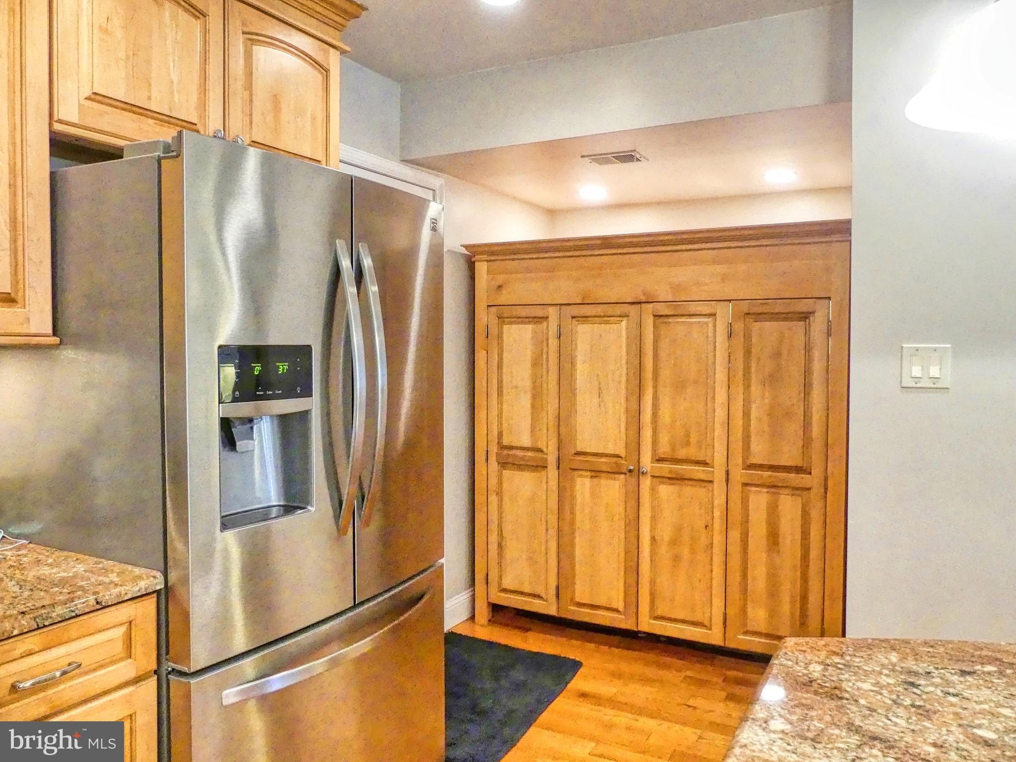 7808 Huntsman Boulevard Springfield, VA 22153 - Photo 27 of 53 Custom built cabinet conceals Washer & Dryer