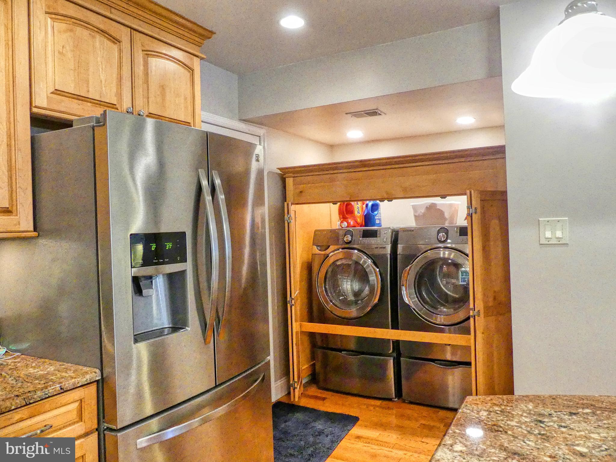 7808 Huntsman Boulevard Springfield, VA 22153 - Photo 28 of 53 Open cabinet to Washer and Dryer