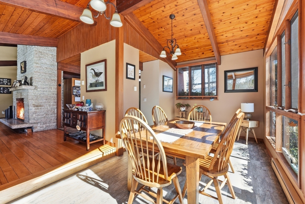 1023 North Woodstock Road Southbridge, MA 01550 - Photo 13 of 41 a view of a patio with dining table and chairs with wooden floor