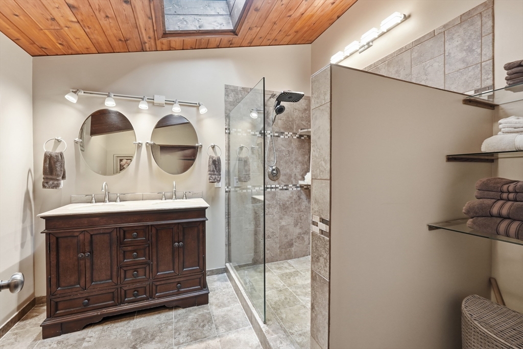 1023 North Woodstock Road Southbridge, MA 01550 - Photo 19 of 41 a view of bathroom with a sink and mirror