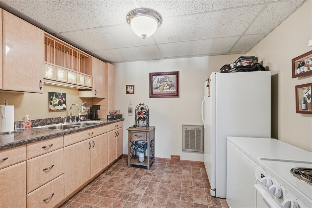 1023 North Woodstock Road Southbridge, MA 01550 - Photo 33 of 41 a kitchen with granite countertop a refrigerator and a sink