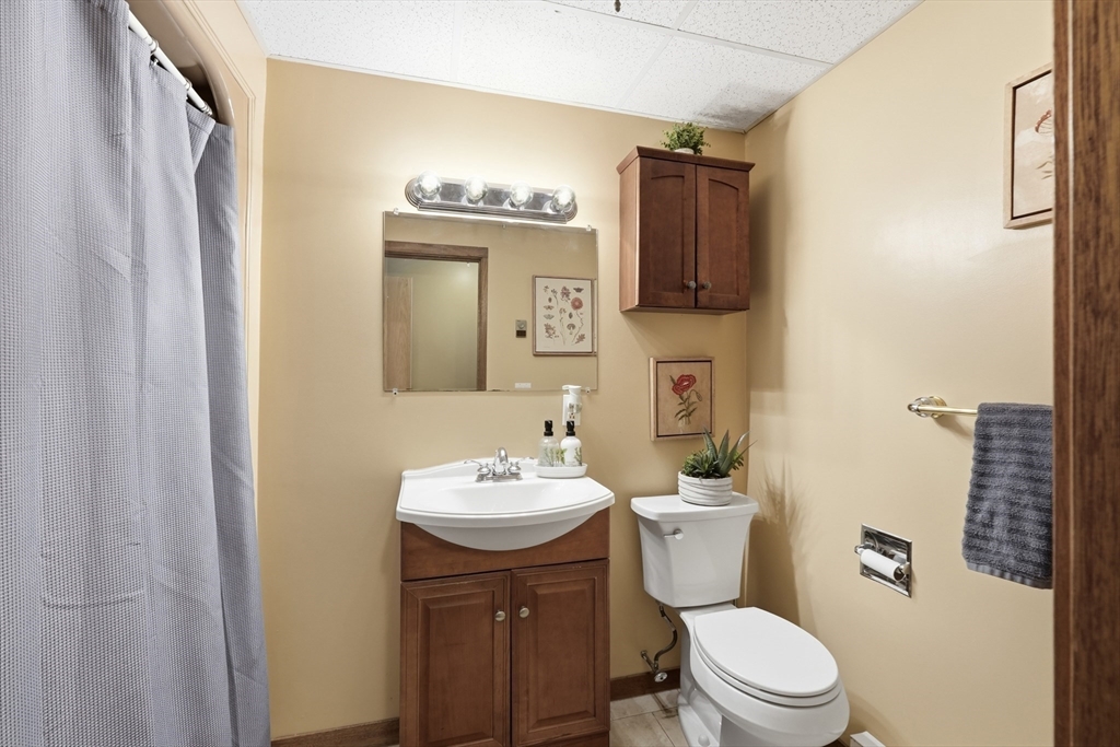 1023 North Woodstock Road Southbridge, MA 01550 - Photo 35 of 41 a bathroom with a toilet a sink and a mirror