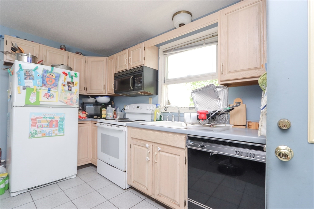 281 Bolton Street Springfield, MA 01119 - Photo 12 of 18 a kitchen with appliances a sink and a window