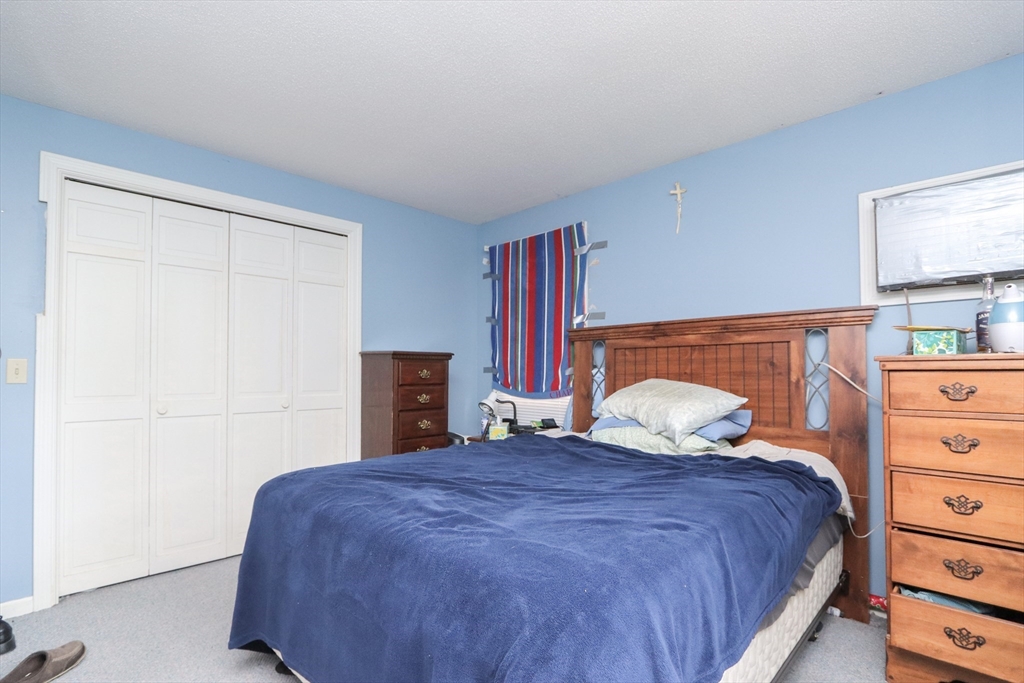 281 Bolton Street Springfield, MA 01119 - Photo 14 of 18 a bedroom with a bed and a closet