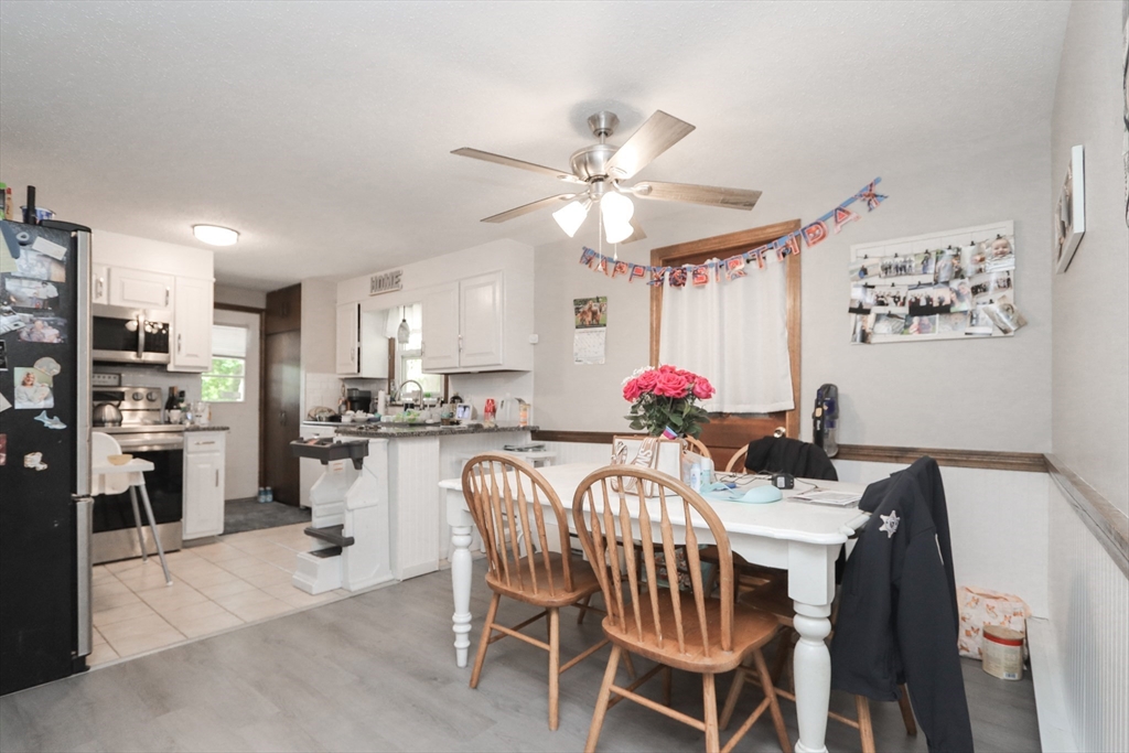 281 Bolton Street Springfield, MA 01119 - Photo 5 of 18 a view of a dining room with furniture and a kitchen