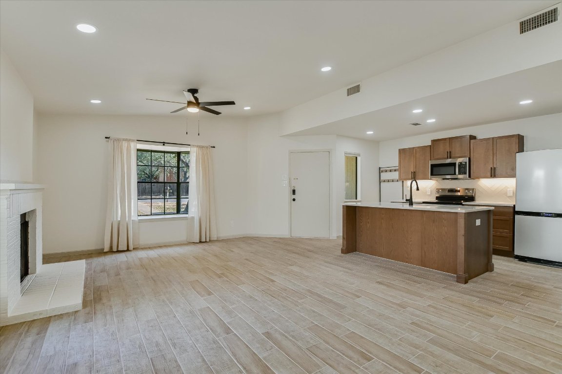 8415 Fathom Circle, Unit B Austin, TX 78750 - Photo 15 of 17 a view of kitchen with sink microwave and refrigerator
