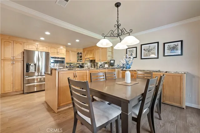 a kitchen with stainless steel appliances granite countertop a stove and white cabinets