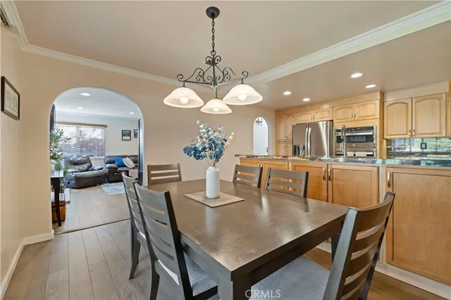 a kitchen with granite countertop a sink stainless steel appliances and cabinets