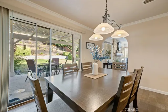 a bathroom with a granite countertop toilet sink and mirror