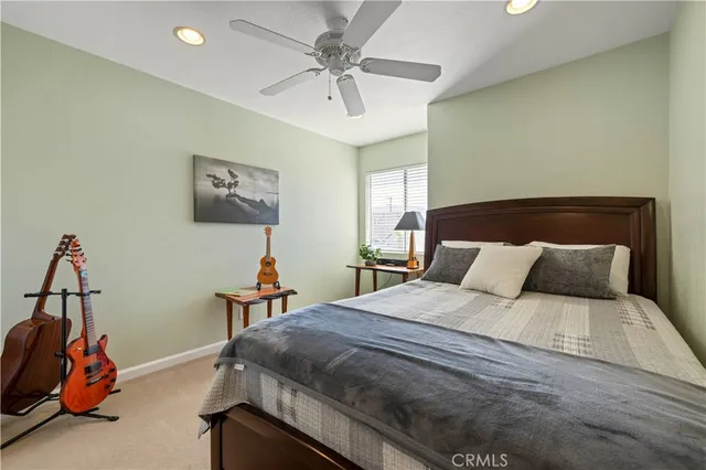 a bedroom with a bed and a fireplace