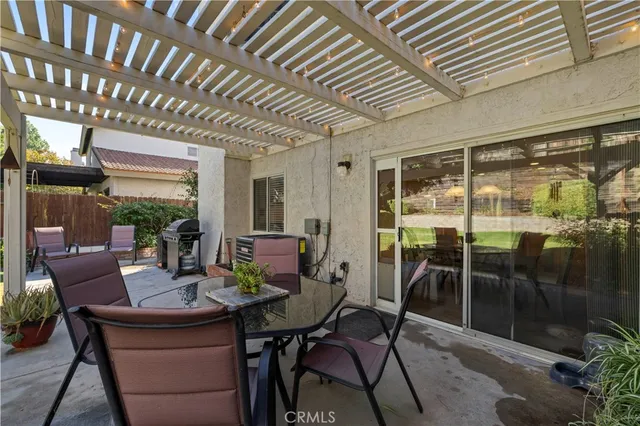 a outdoor dining space with furniture