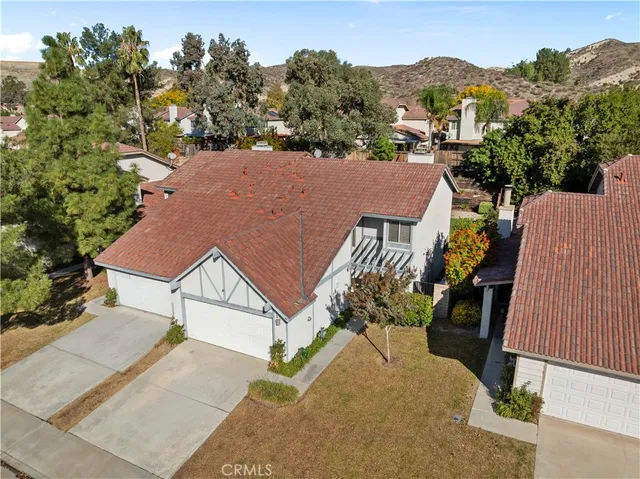 a bedroom with a bed window and a desk