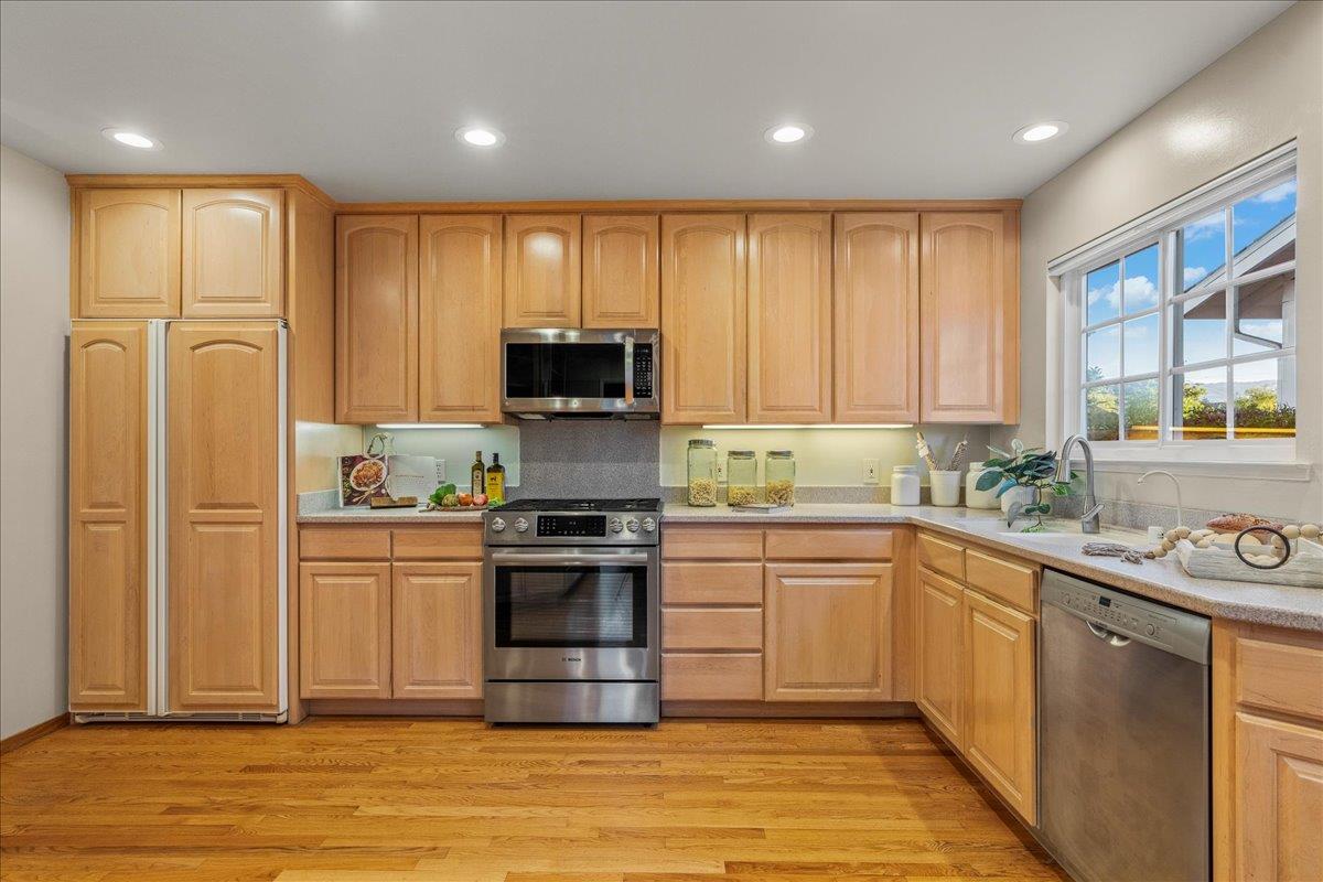 877 West Knickerbocker Drive Sunnyvale, CA 94087 - Photo 11 of 51 a kitchen with stainless steel appliances granite countertop a refrigerator sink and stove